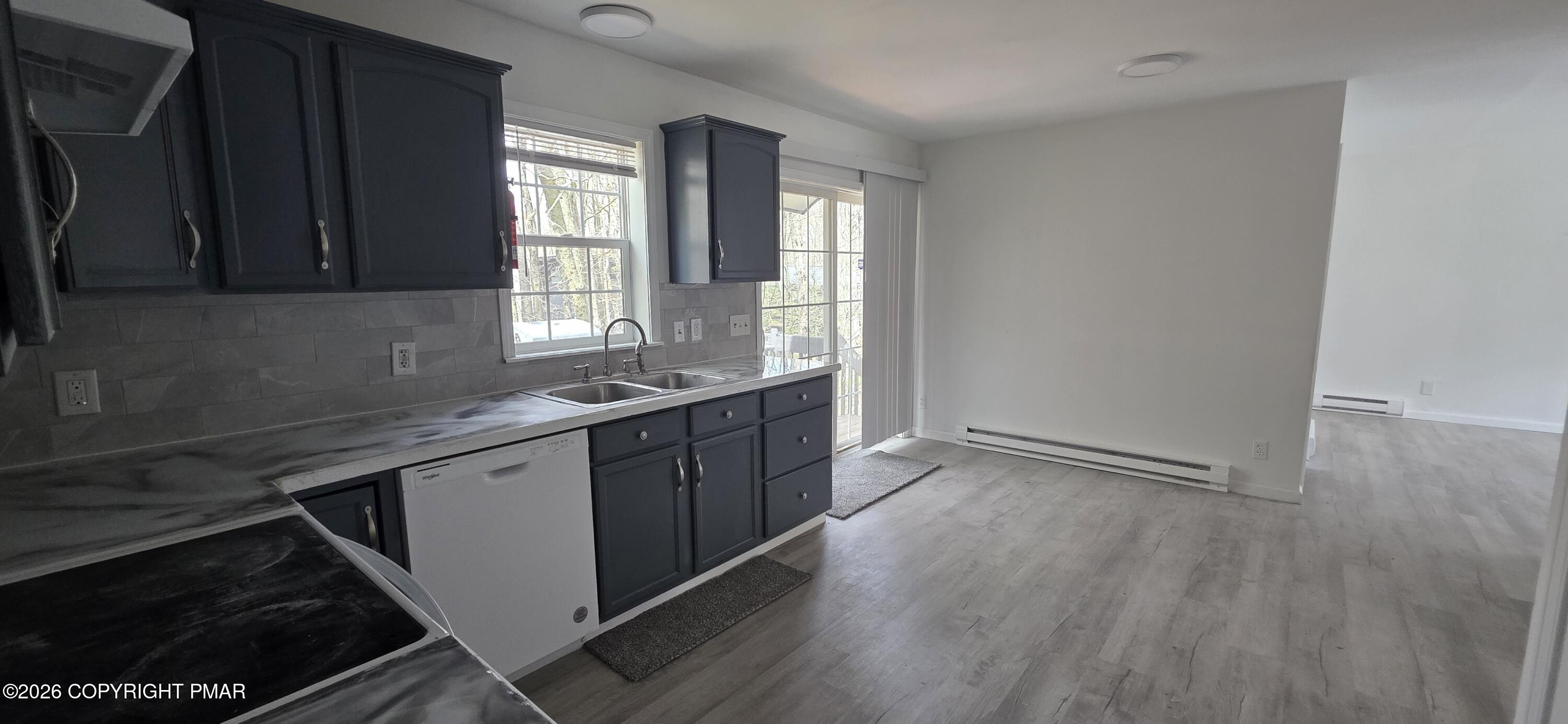 4715 Norwood Lane Tobyhanna, PA 18466 - Photo 5 of 14 a kitchen with a sink stove and cabinets