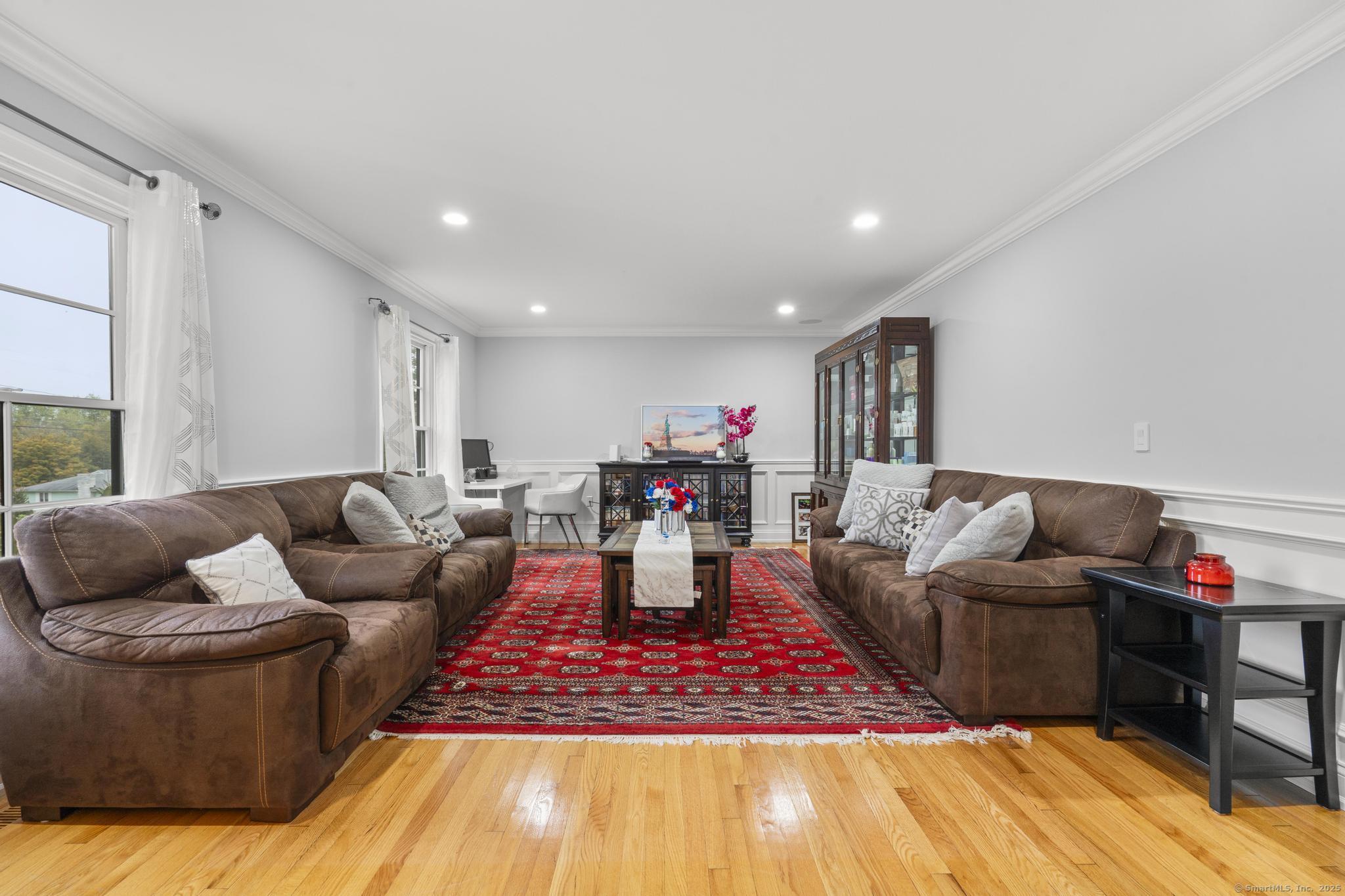 14 East Gate Road Danbury, CT 06811 - Photo 11 of 40 a living room with furniture and a wooden floor