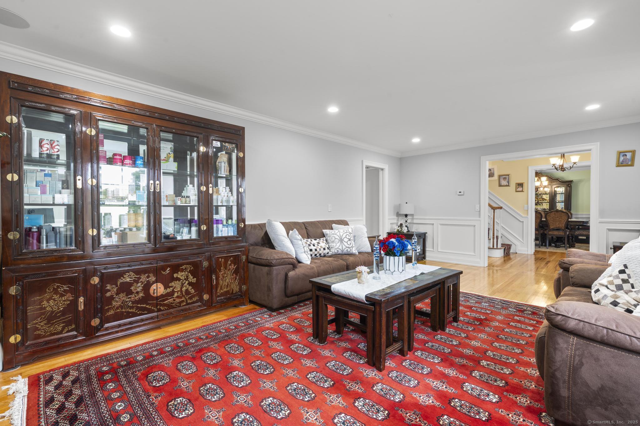 14 East Gate Road Danbury, CT 06811 - Photo 12 of 40 a living room with furniture and a floor to ceiling window