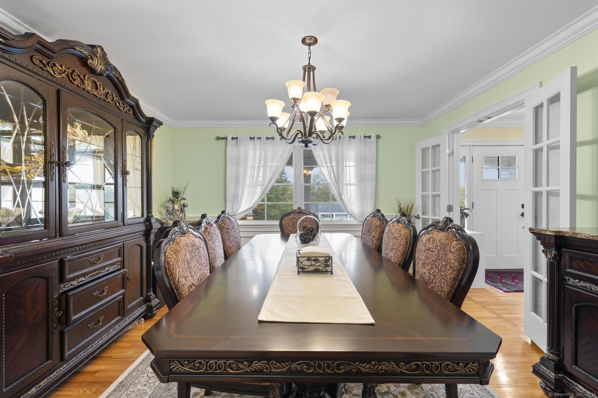 14 East Gate Road Danbury, CT 06811 - Photo 15 of 40 a living room with furniture chandelier and a large window