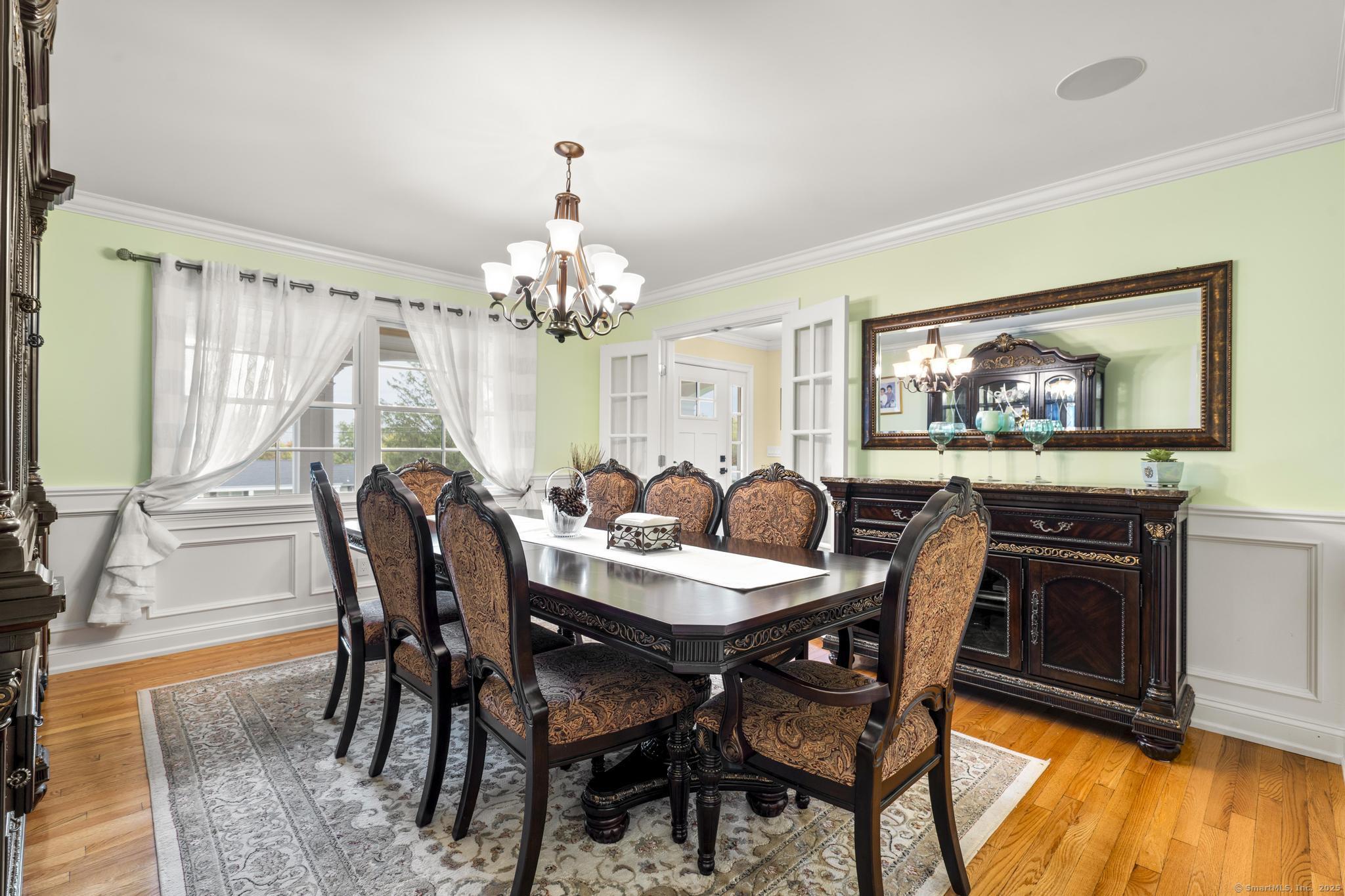 14 East Gate Road Danbury, CT 06811 - Photo 16 of 40 a view of a dining room with furniture and wooden floor
