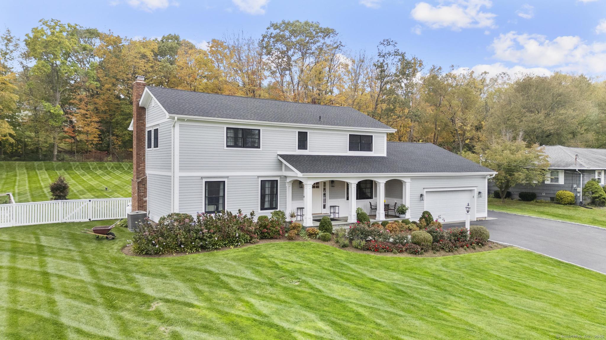 14 East Gate Road Danbury, CT 06811 - Photo 2 of 40 a front view of house with yard and green space