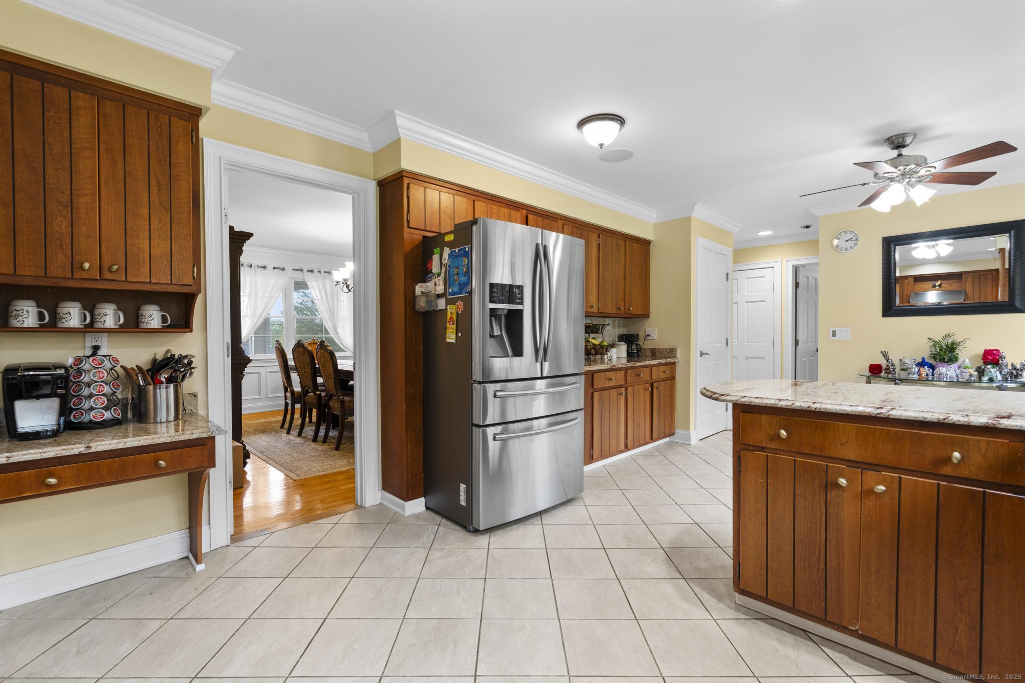 14 East Gate Road Danbury, CT 06811 - Photo 21 of 40 a kitchen with stainless steel appliances granite countertop a refrigerator and a sink