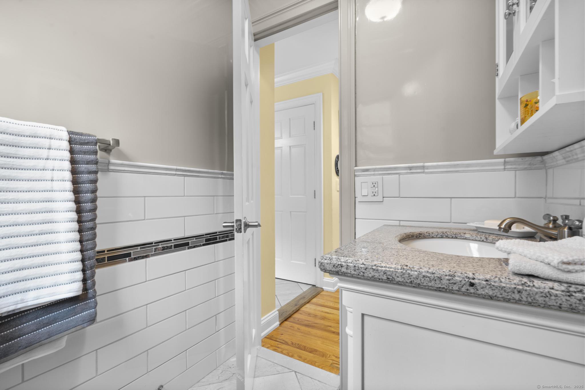 14 East Gate Road Danbury, CT 06811 - Photo 24 of 40 a bathroom with a granite countertop sink and a mirror