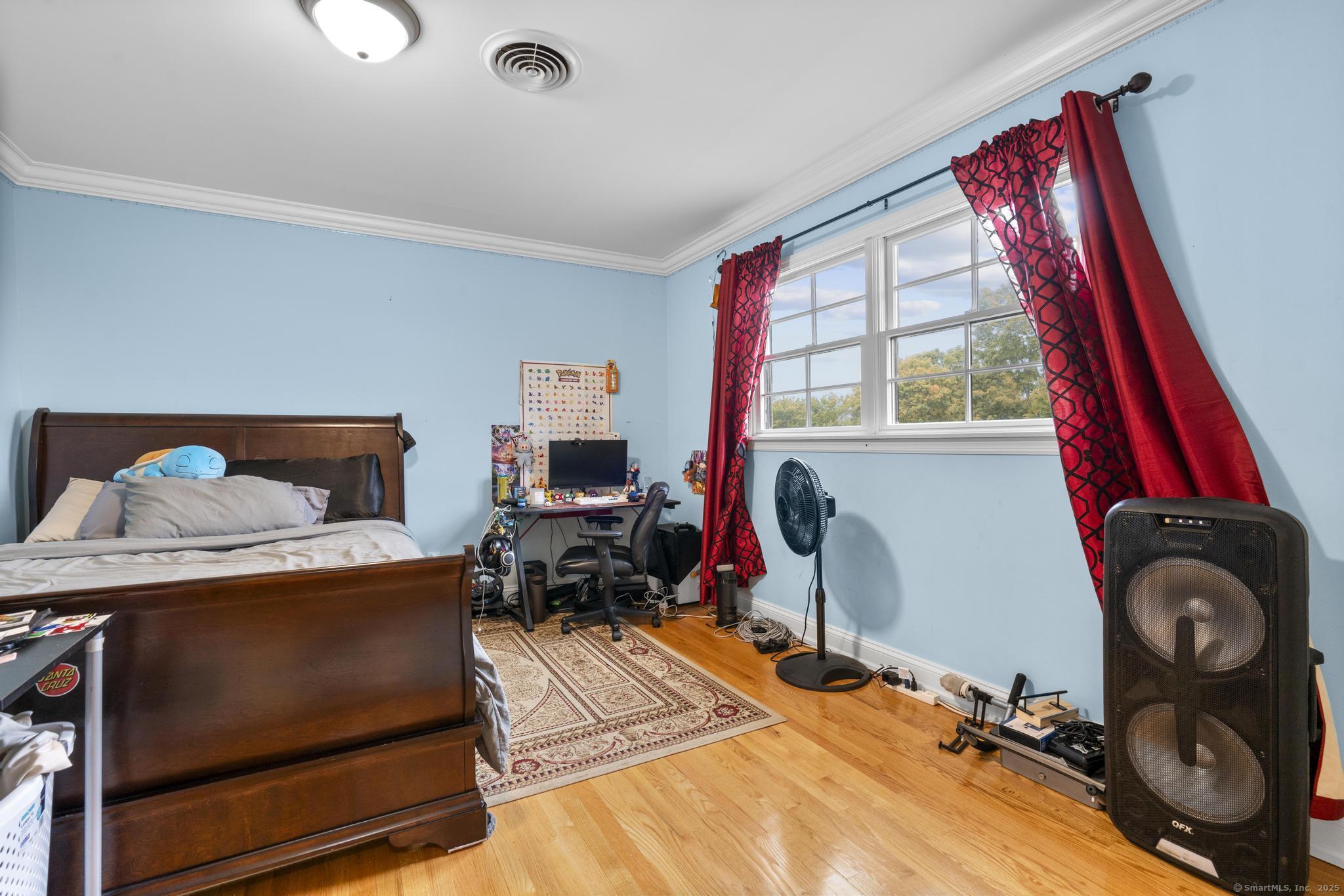 14 East Gate Road Danbury, CT 06811 - Photo 29 of 40 a bedroom with a bed and a window