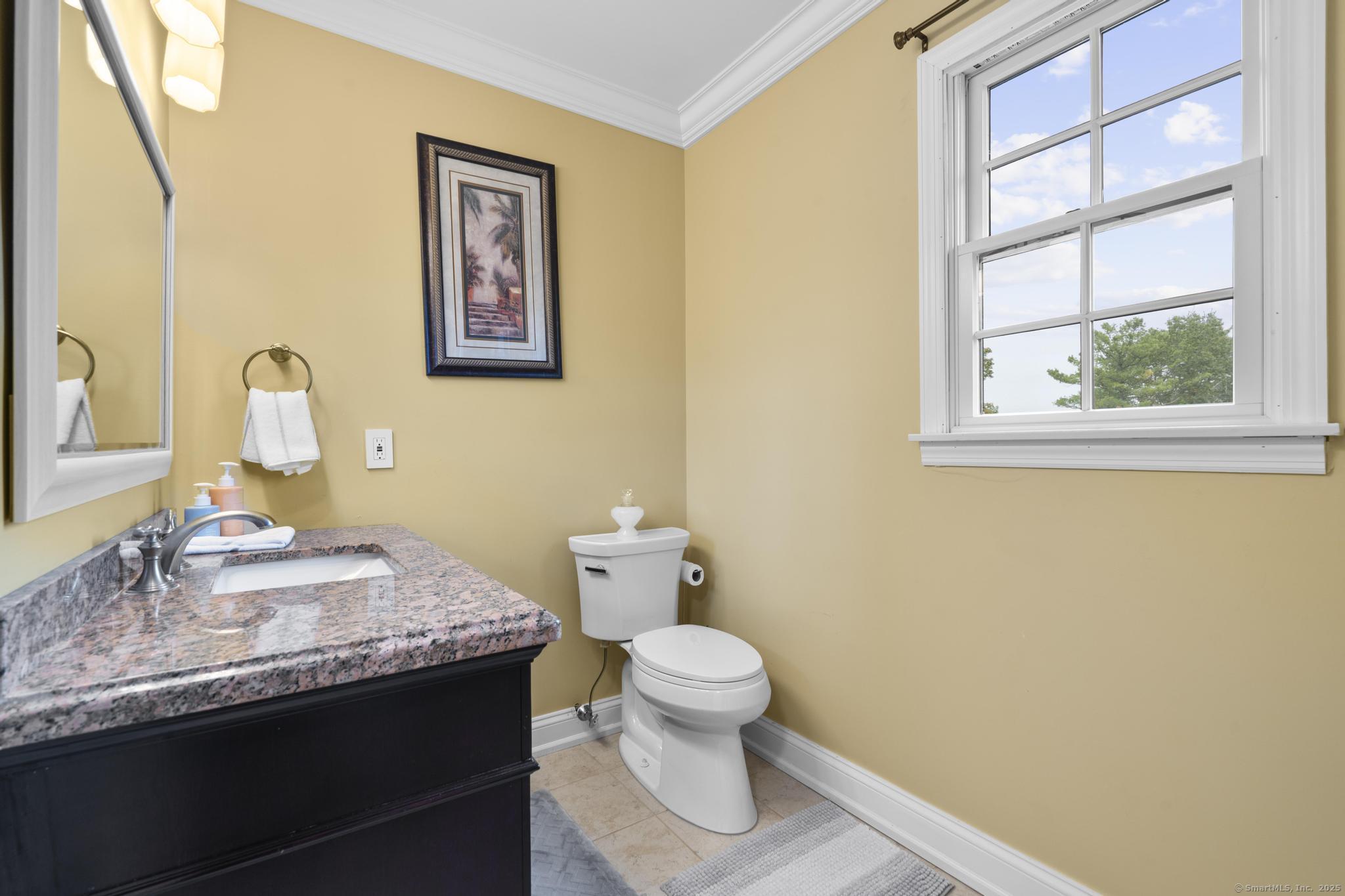 14 East Gate Road Danbury, CT 06811 - Photo 32 of 40 a bathroom with a granite countertop sink mirror and toilet