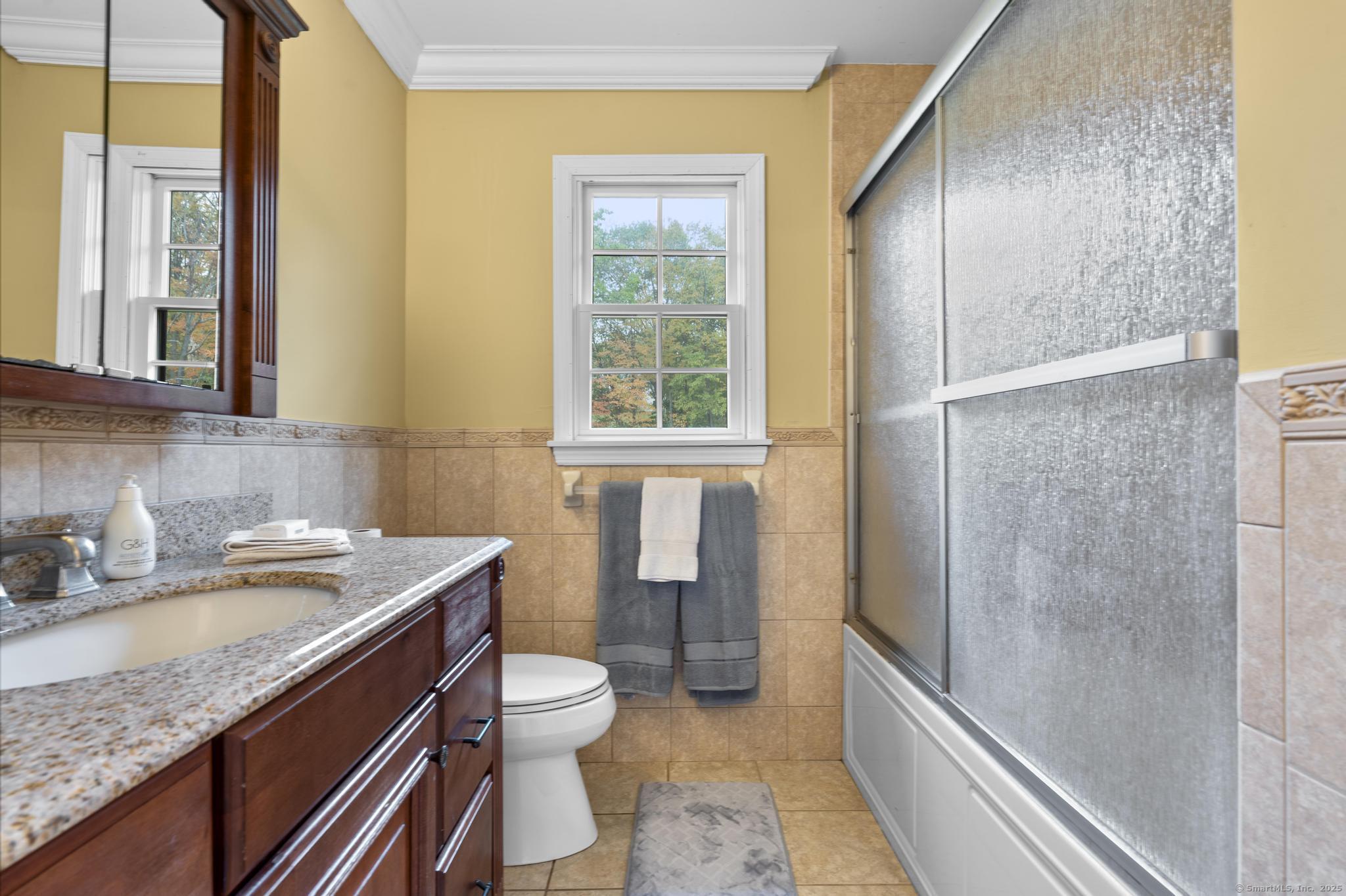 14 East Gate Road Danbury, CT 06811 - Photo 36 of 40 a bathroom with a granite countertop sink toilet and shower