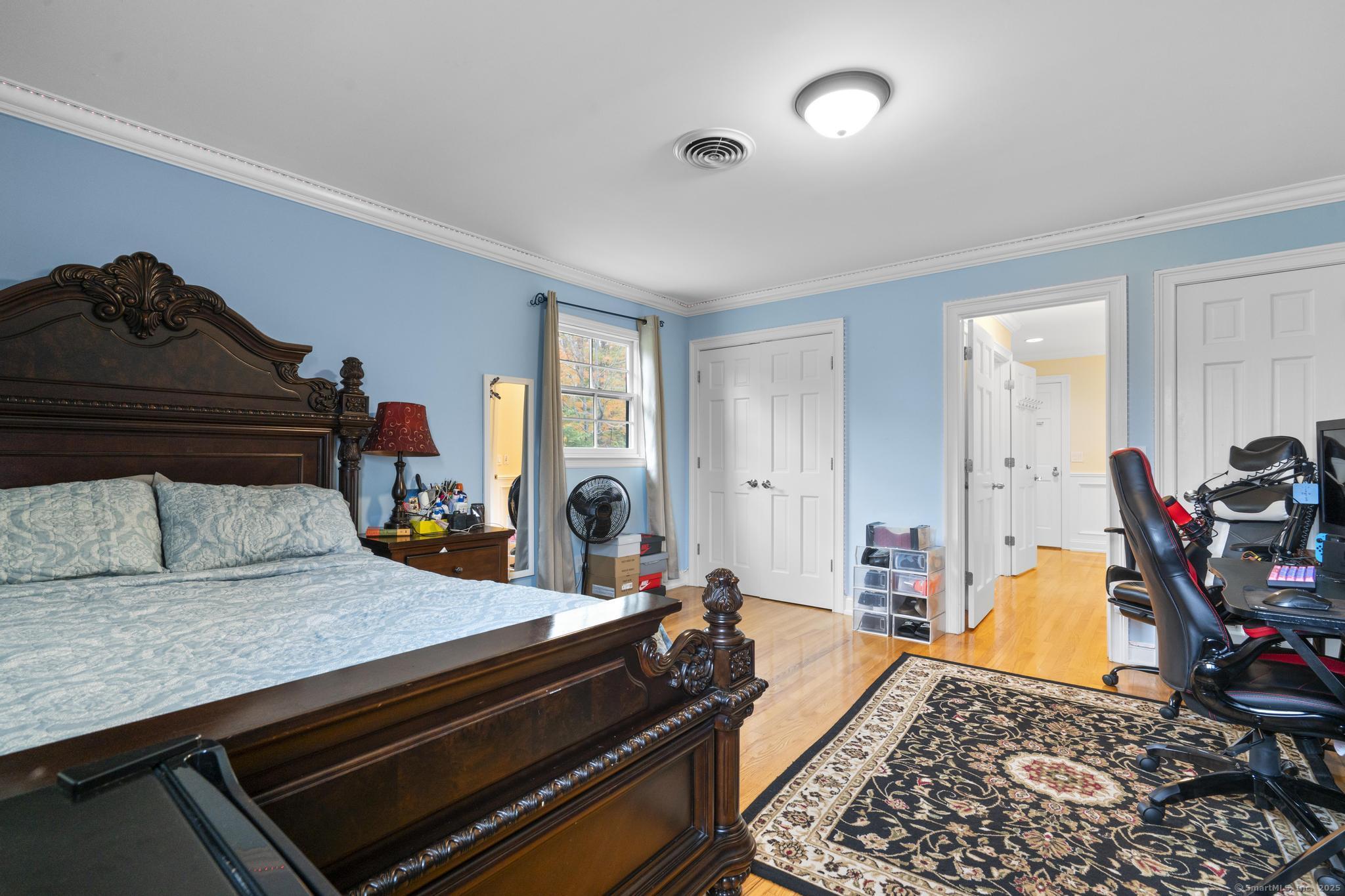 14 East Gate Road Danbury, CT 06811 - Photo 38 of 40 a bedroom with furniture and a wooden floor