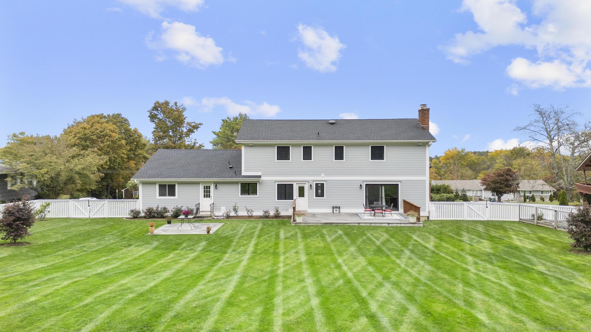 14 East Gate Road Danbury, CT 06811 - Photo 4 of 40 a view of a house with a yard deck and sitting area