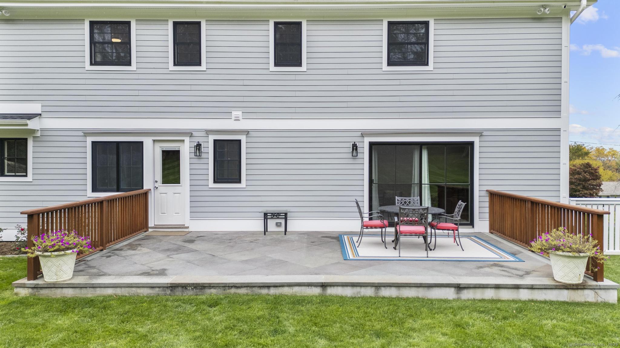 14 East Gate Road Danbury, CT 06811 - Photo 7 of 40 a backyard of a house with outdoor seating