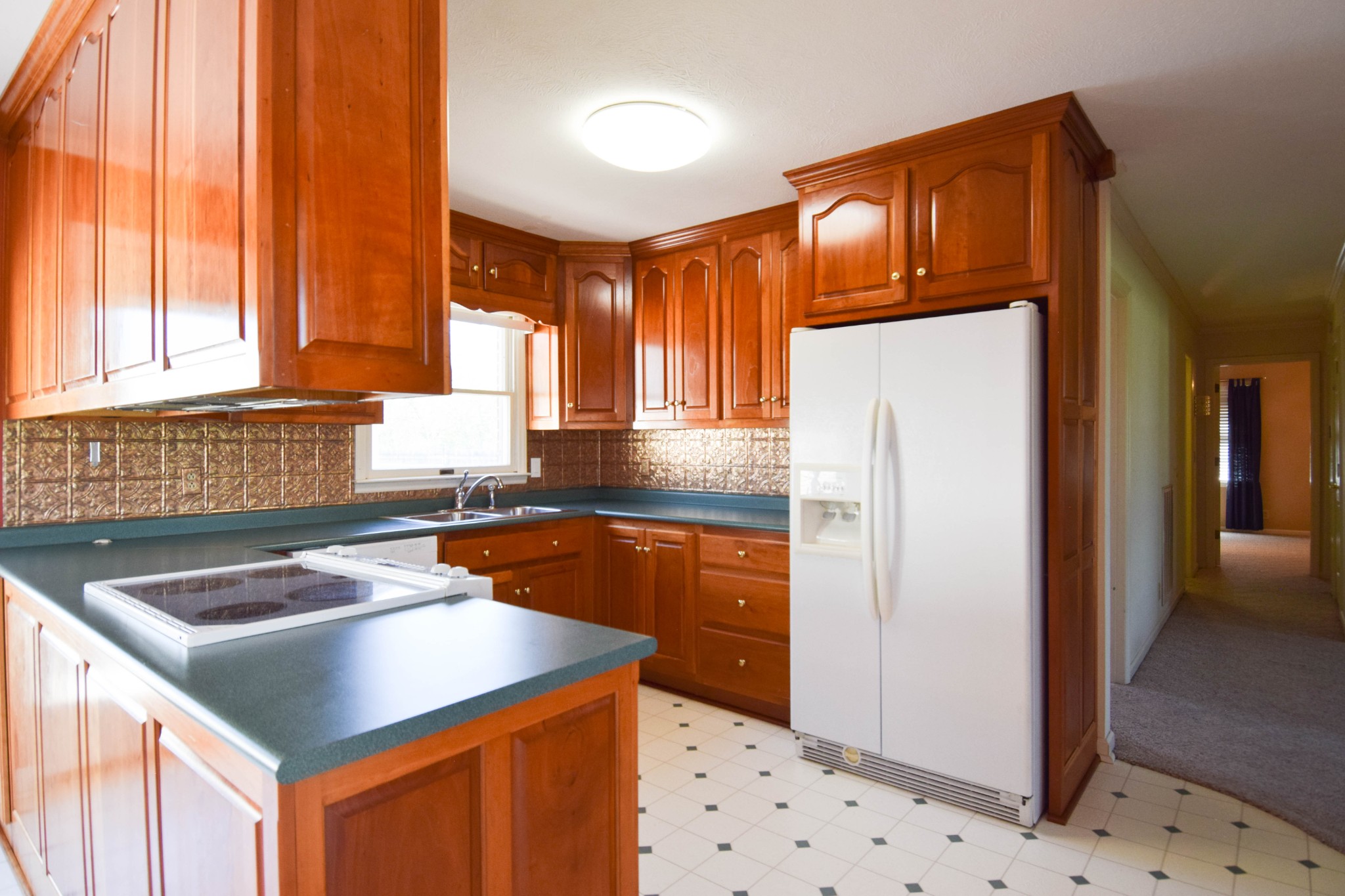 1059 Robertson Road Gallatin, TN 37066 - Photo 29 of 84 a kitchen with granite countertop a sink a counter top space and cabinets