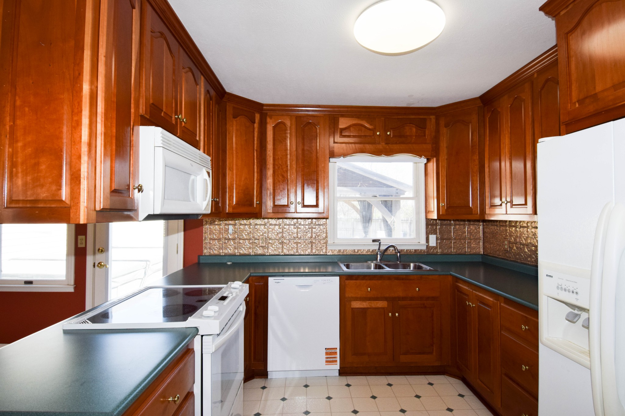 1059 Robertson Road Gallatin, TN 37066 - Photo 31 of 84 a kitchen with stainless steel appliances granite countertop a sink a stove and a microwave