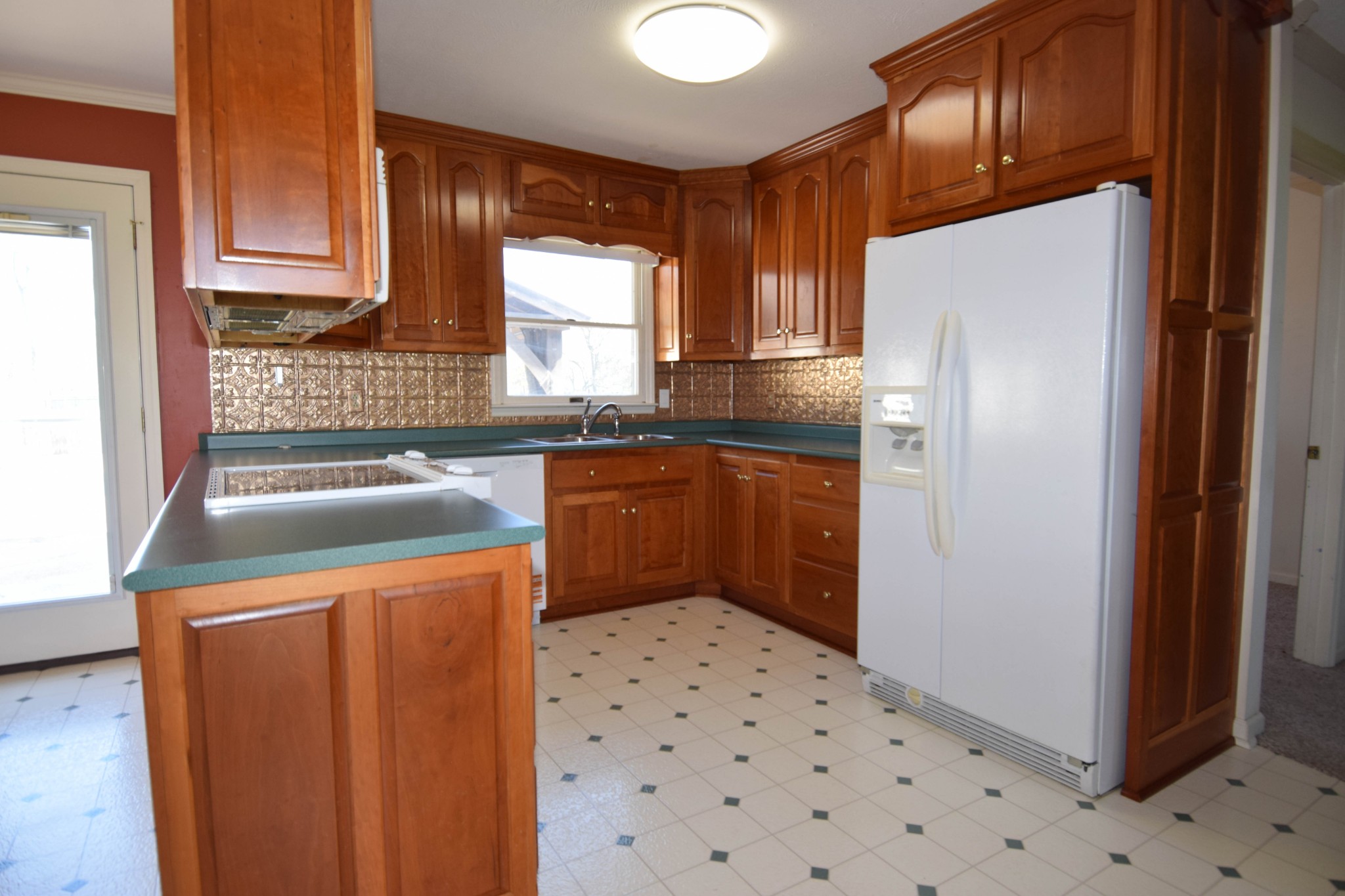 1059 Robertson Road Gallatin, TN 37066 - Photo 33 of 84 a kitchen with granite countertop a refrigerator a sink a stove and dishwasher