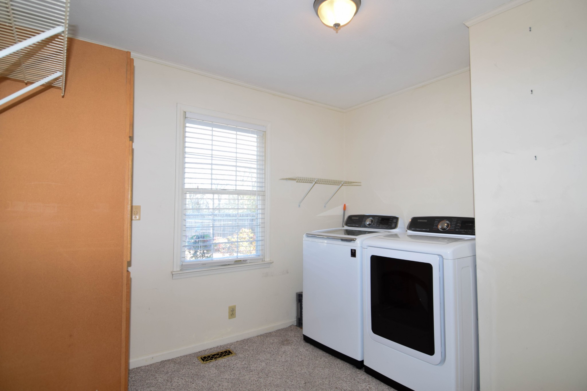 1059 Robertson Road Gallatin, TN 37066 - Photo 42 of 84 a view of washer and dryer with kitchen in the background
