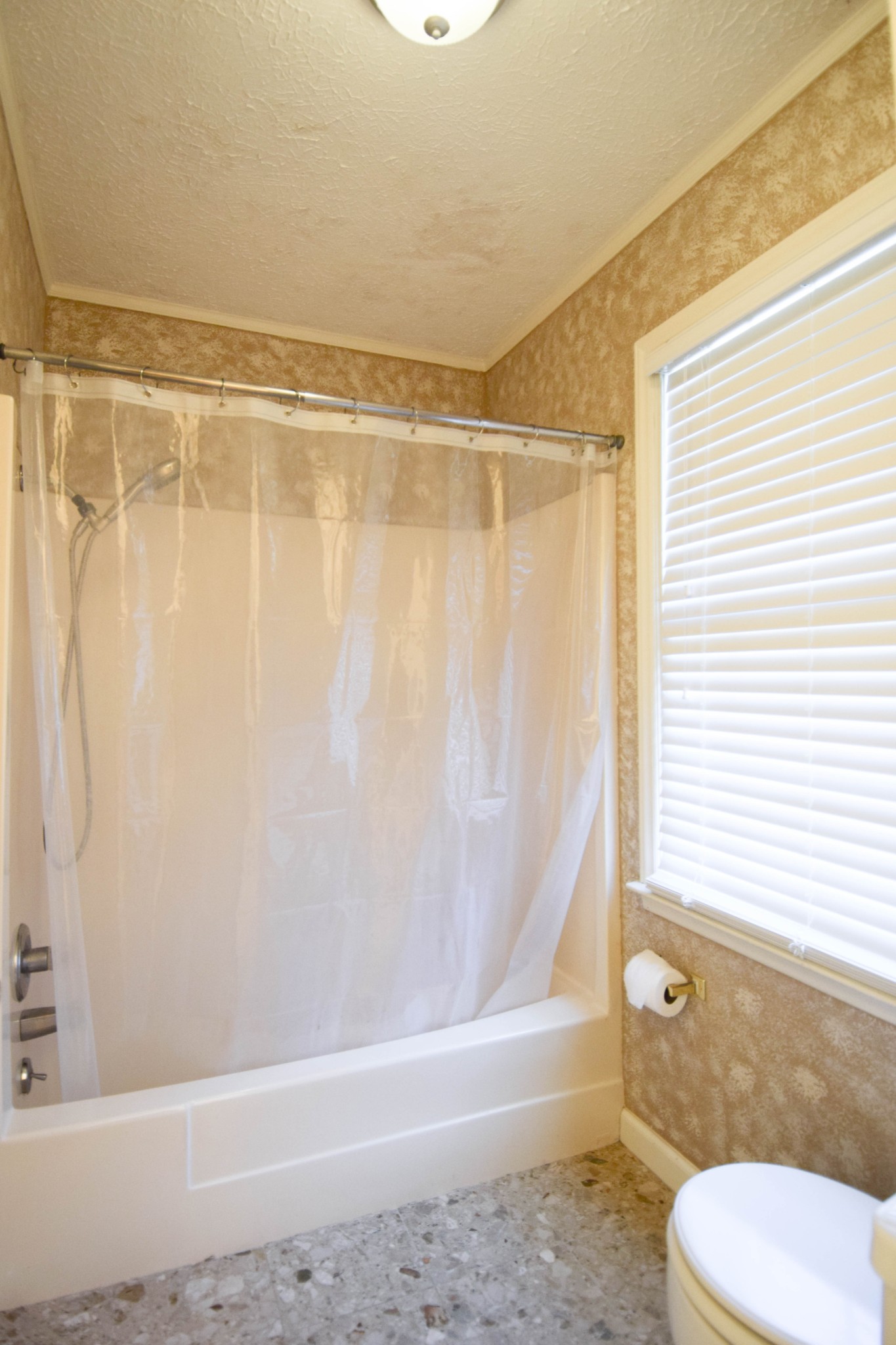 1059 Robertson Road Gallatin, TN 37066 - Photo 49 of 84 a bathroom with a shower curtain and a window