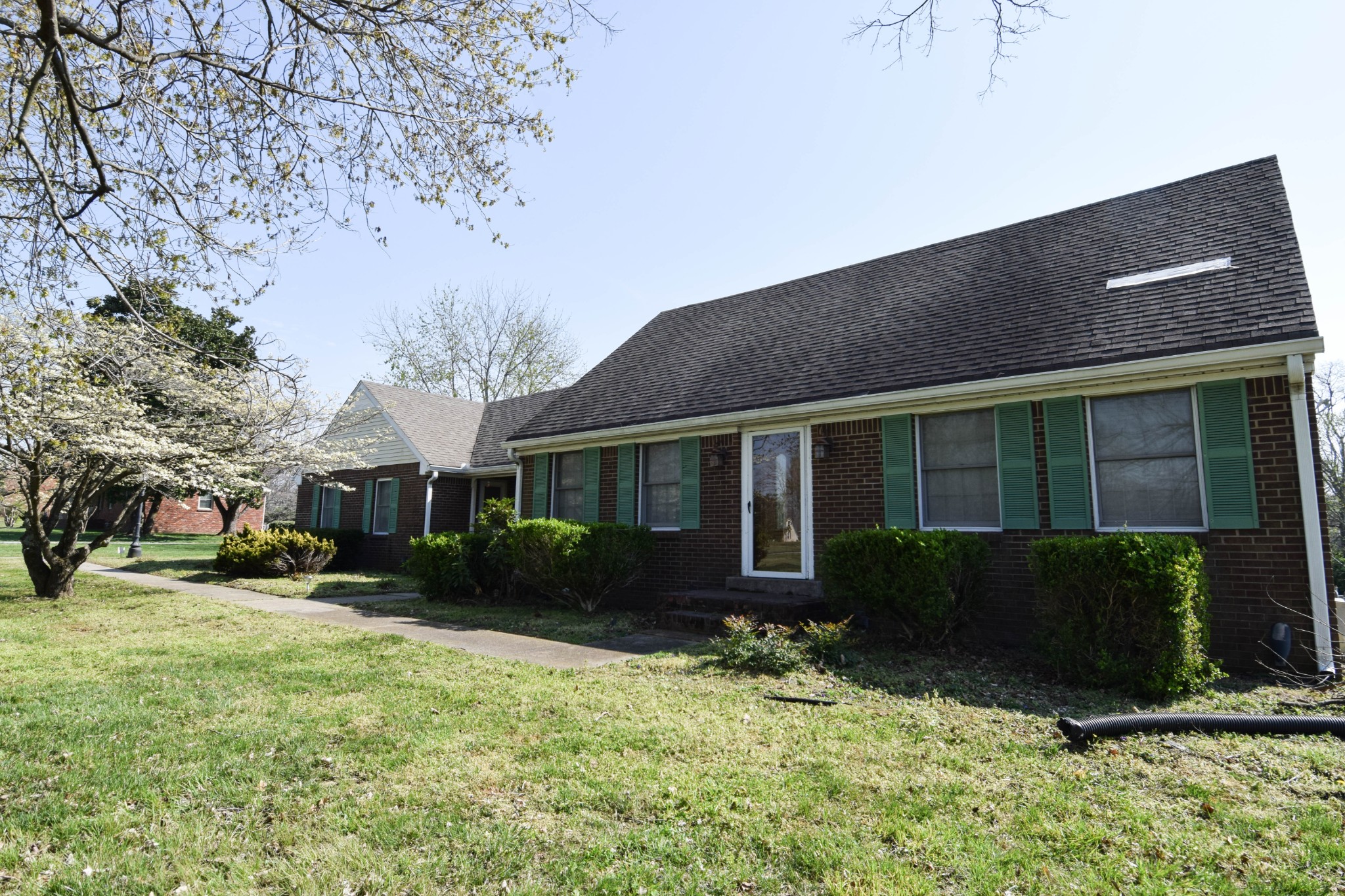 1059 Robertson Road Gallatin, TN 37066 - Photo 10 of 84 a front view of a house with a yard and potted plants
