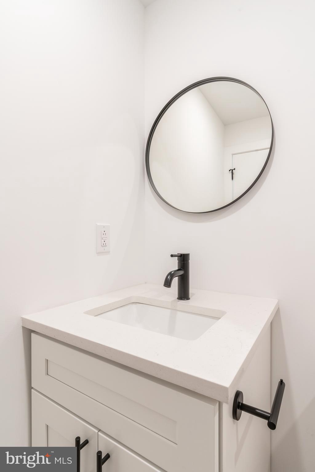 2002 Frankford Avenue, Unit 202 Philadelphia, PA 19125 - Photo 17 of 20 a bathroom with a sink and a mirror