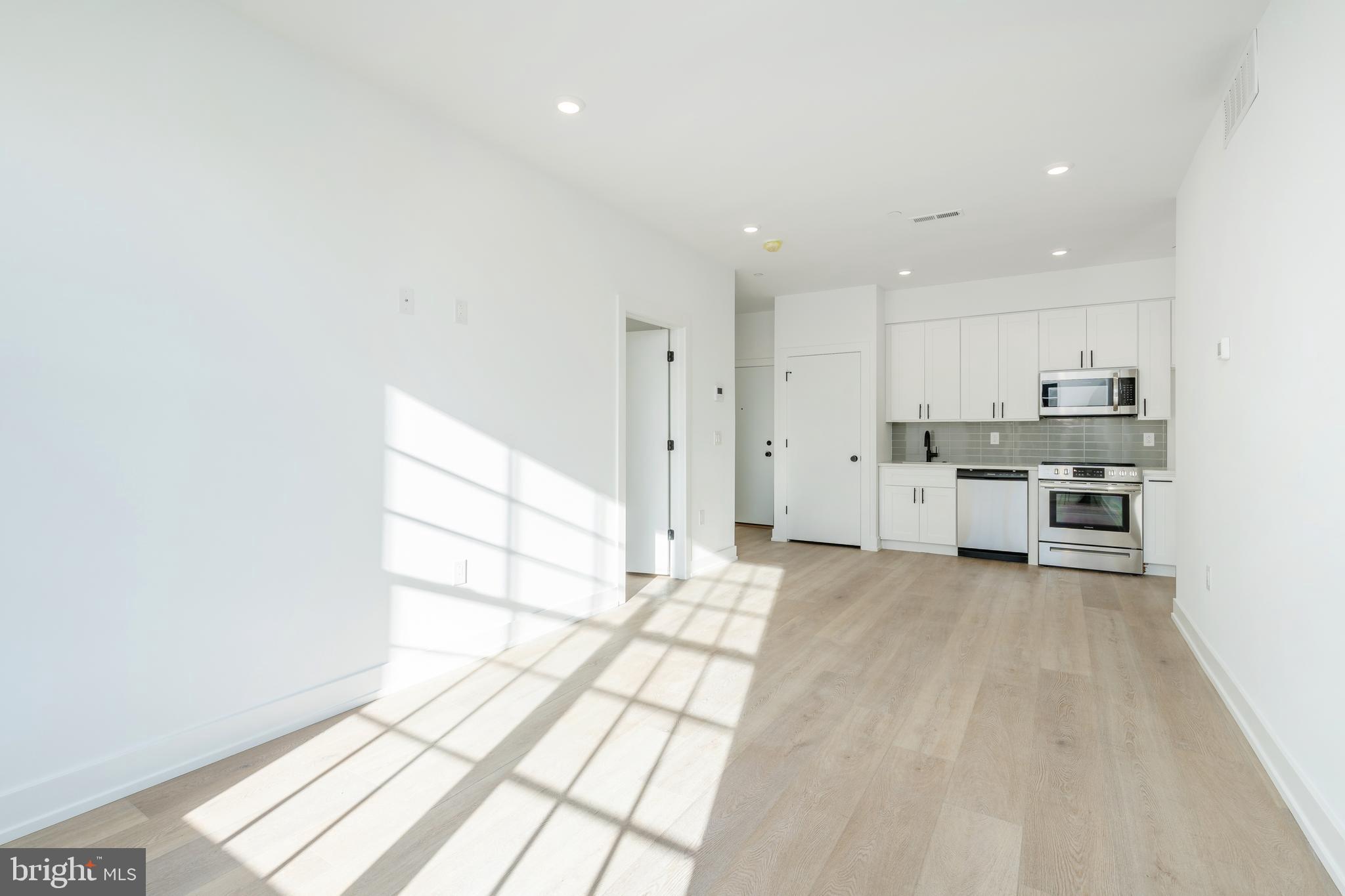2002 Frankford Avenue, Unit 202 Philadelphia, PA 19125 - Photo 2 of 20 a view of a kitchen with wooden floor