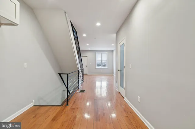 a kitchen with cabinets stainless steel appliances and a window