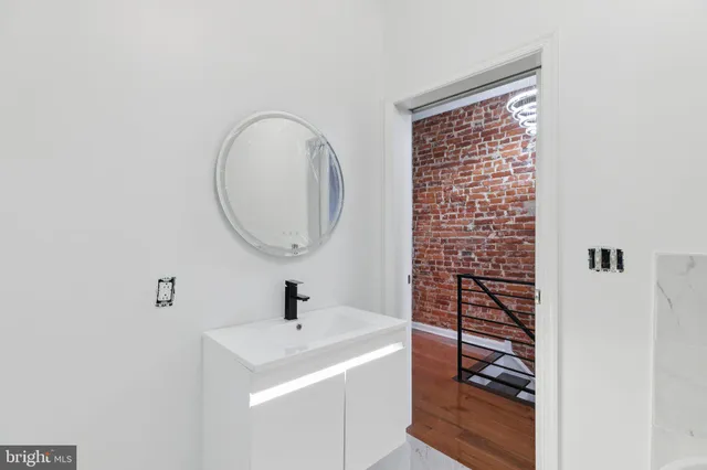 a bathroom with a tub and toilet