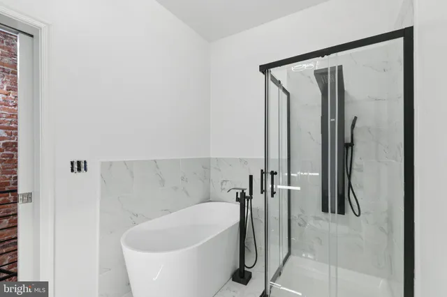 a bedroom with bed and window