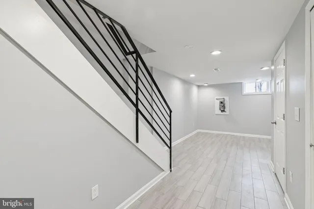 a view of room with wooden floor and fan
