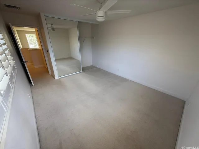 an empty room with a mirror