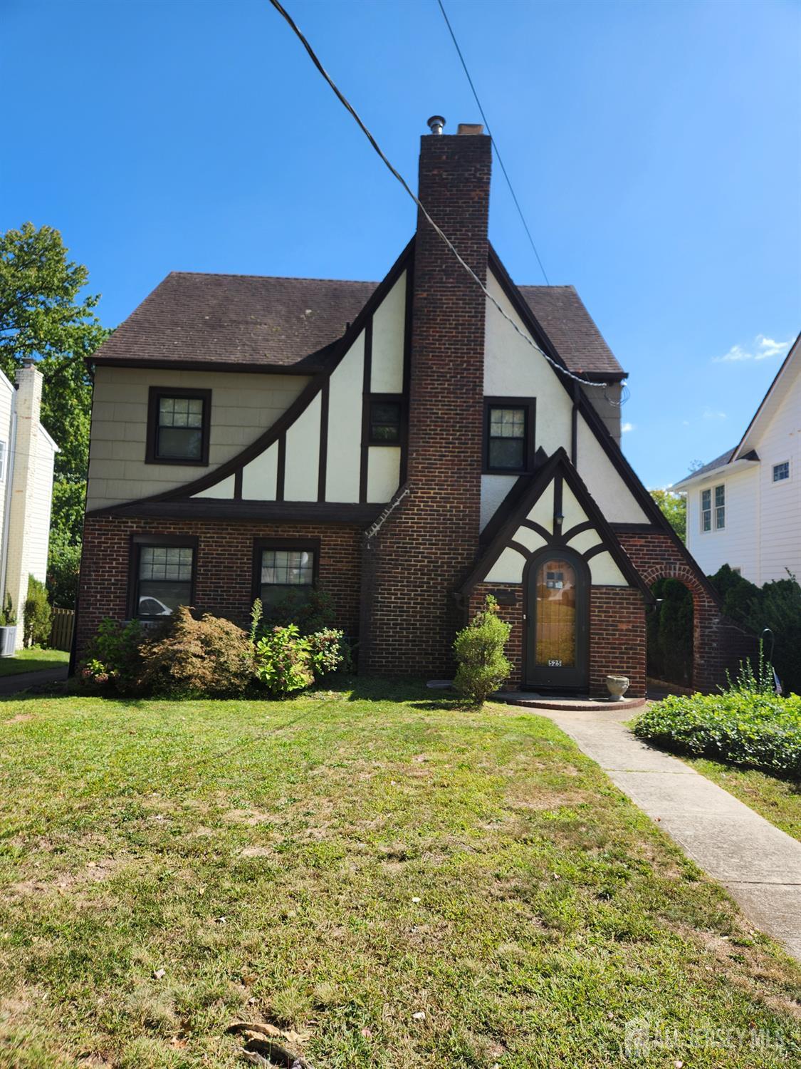 a front view of a house with yard