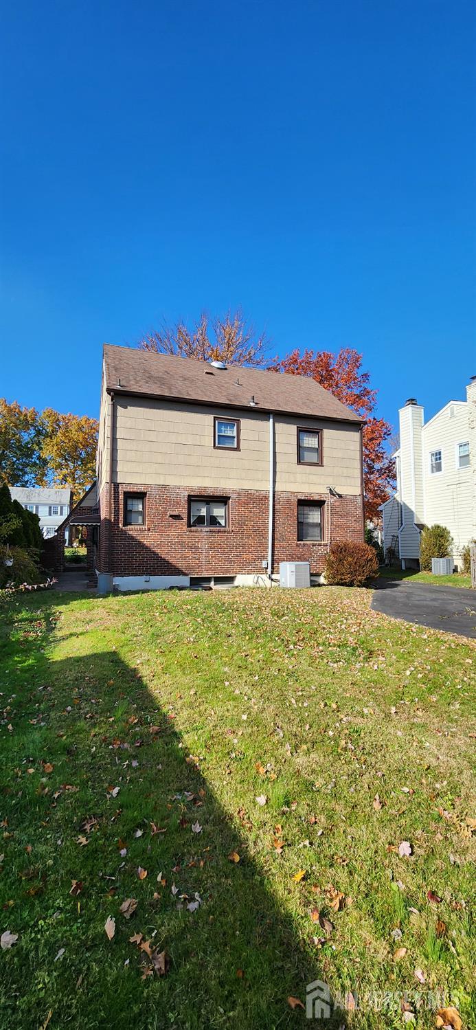 525 Edgar Road Westfield, NJ 07090 - Photo 7 of 9 a front view of a house with a garden