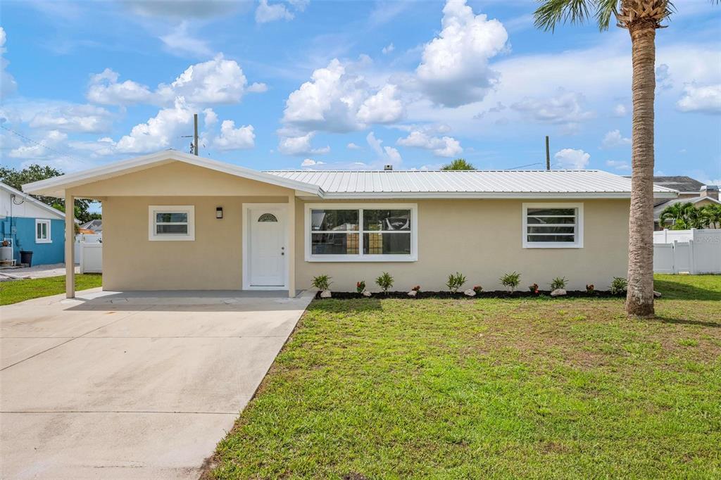 609 Carmel Road Venice, FL 34293 - Photo 1 of 1 a view of a house with a garden and yard
