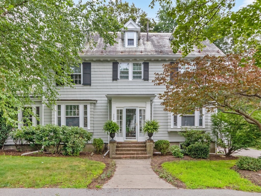 204 Pleasant Street Newton, MA 02459 - Photo 1 of 27 a front view of a house with a garden