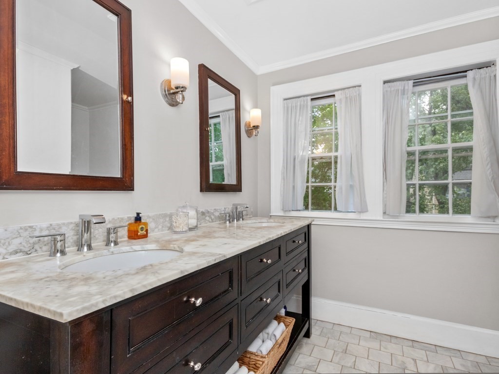 204 Pleasant Street Newton, MA 02459 - Photo 16 of 27 a bathroom with a granite countertop sink and a mirror