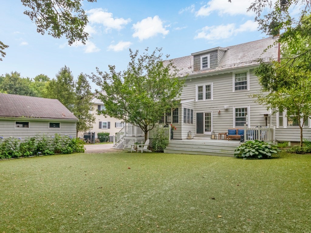 204 Pleasant Street Newton, MA 02459 - Photo 2 of 27 a front view of a house with a yard and trees