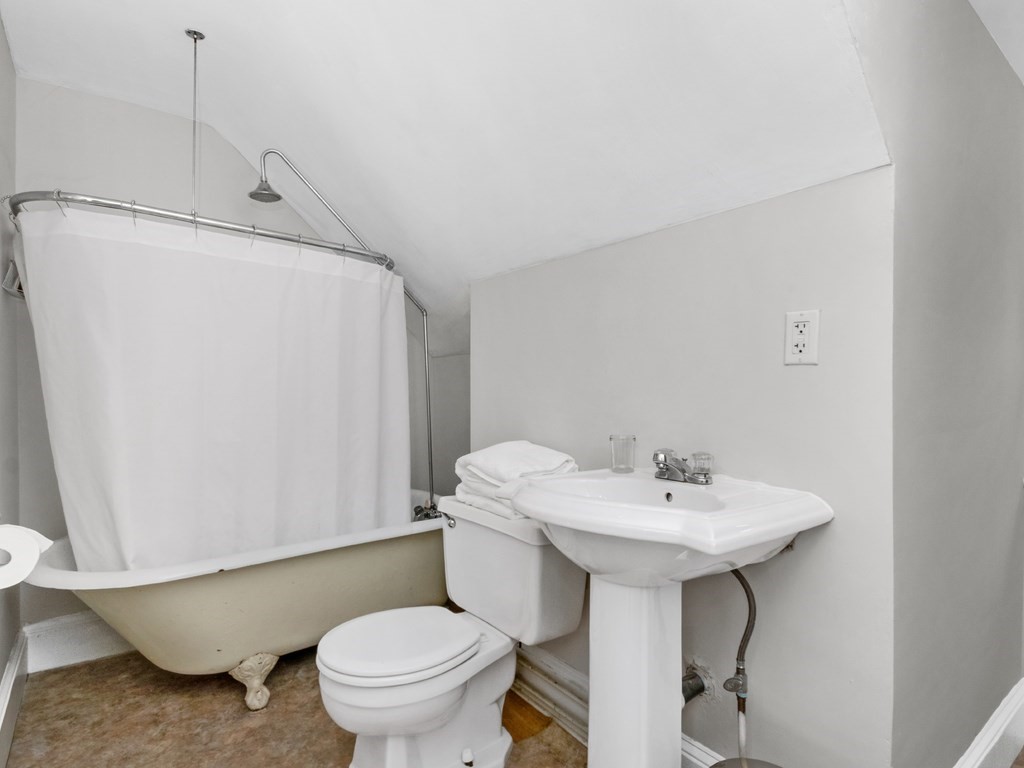 204 Pleasant Street Newton, MA 02459 - Photo 22 of 27 a bathroom with a sink toilet and a mirror