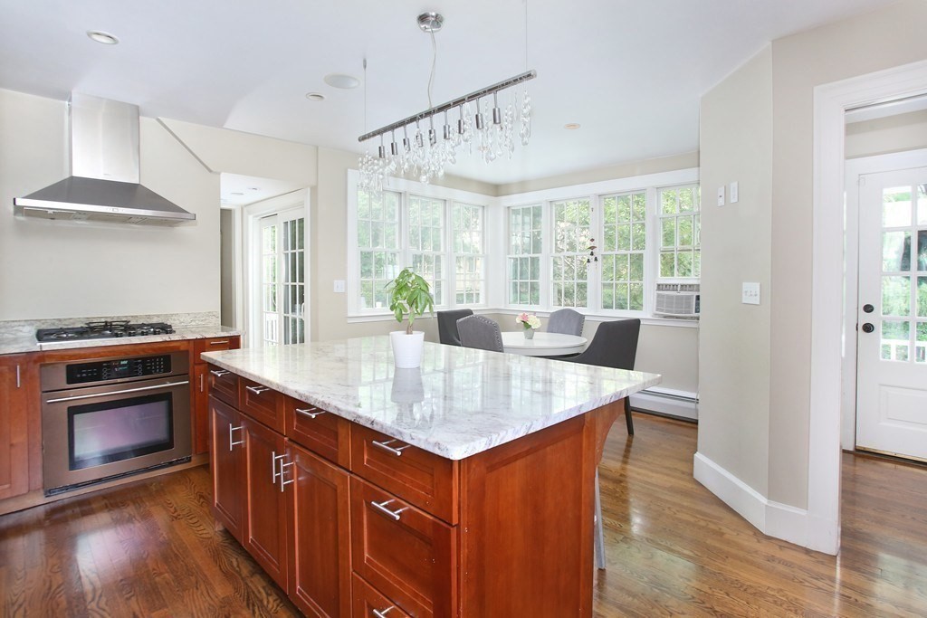 204 Pleasant Street Newton, MA 02459 - Photo 4 of 27 a kitchen with stainless steel appliances granite countertop a stove and a sink