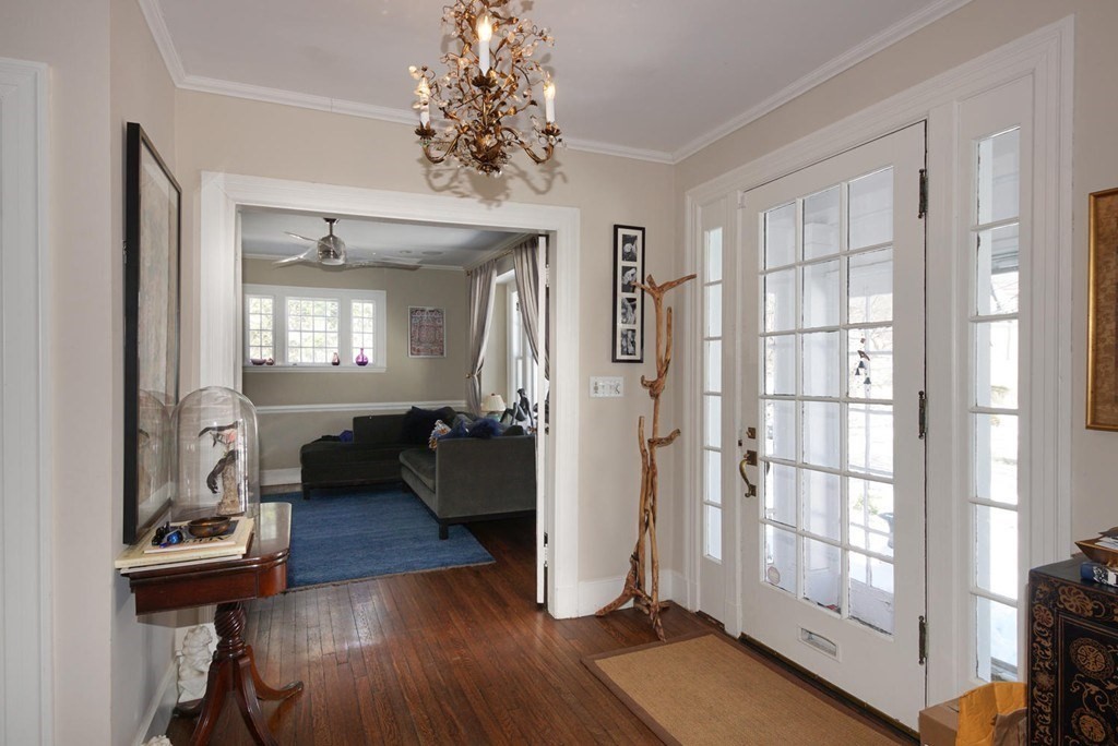 204 Pleasant Street Newton, MA 02459 - Photo 7 of 27 a living room with furniture and a chandelier