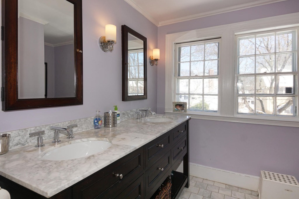 204 Pleasant Street Newton, MA 02459 - Photo 8 of 27 a bathroom with a granite countertop sink and a mirror
