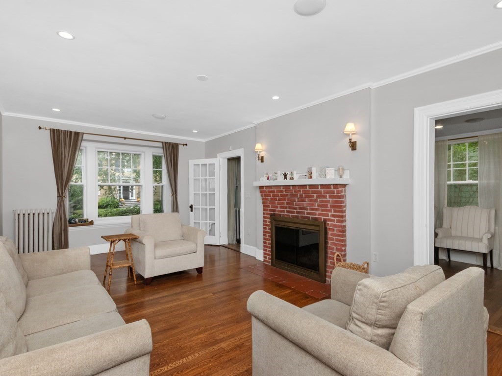 204 Pleasant Street Newton, MA 02459 - Photo 10 of 27 a living room with furniture large window and fireplace