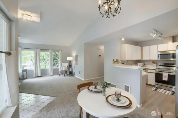 a view of a livingroom with an empty space and a fireplace