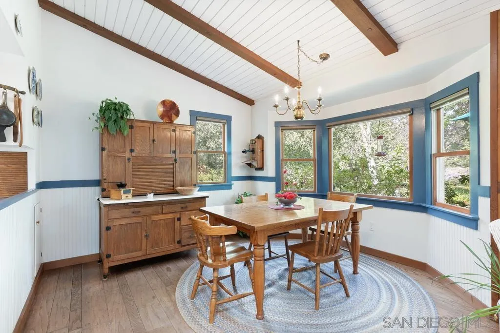13636 Jack Rabbit Road Poway, CA 92064 - Photo 14 of 29 a view of a dining room with furniture window and wooden floor