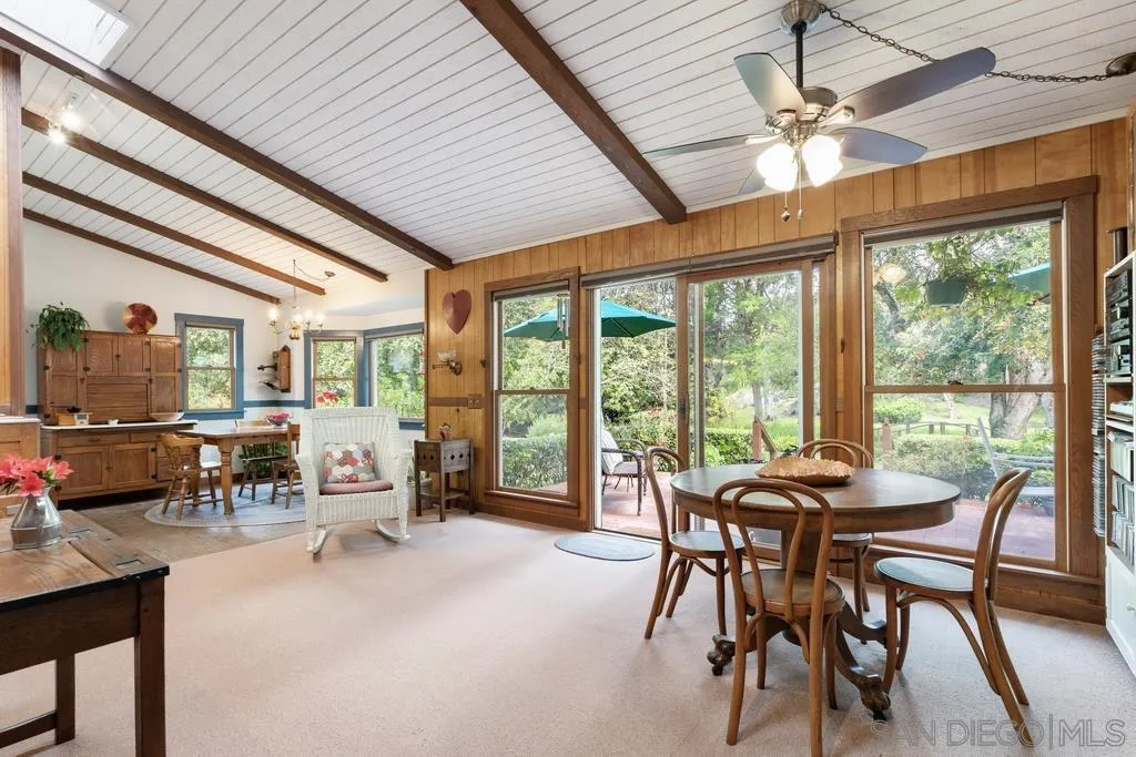 13636 Jack Rabbit Road Poway, CA 92064 - Photo 16 of 29 a dining room with furniture water view and a large window