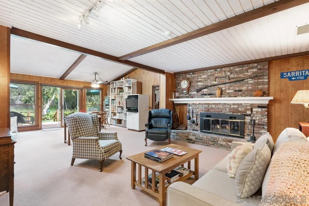 13636 Jack Rabbit Road Poway, CA 92064 - Photo 18 of 29 a living room with fireplace furniture and a large window