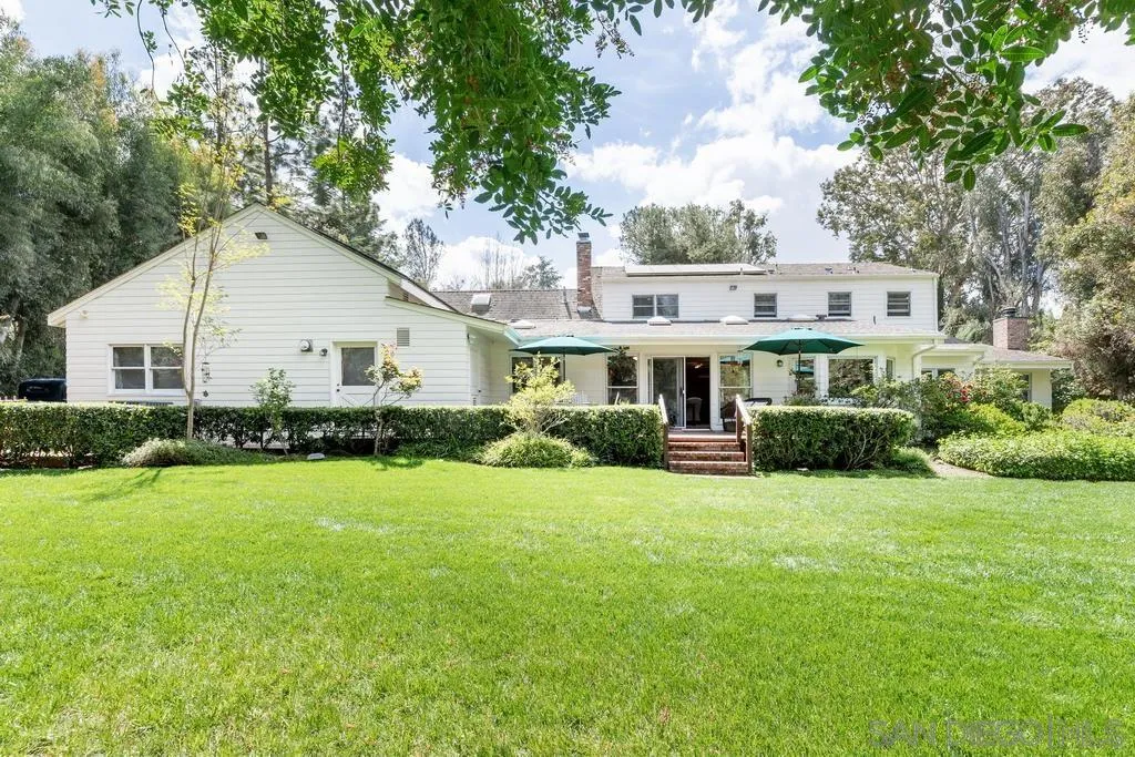 13636 Jack Rabbit Road Poway, CA 92064 - Photo 4 of 29 a front view of a house with a yard and garage
