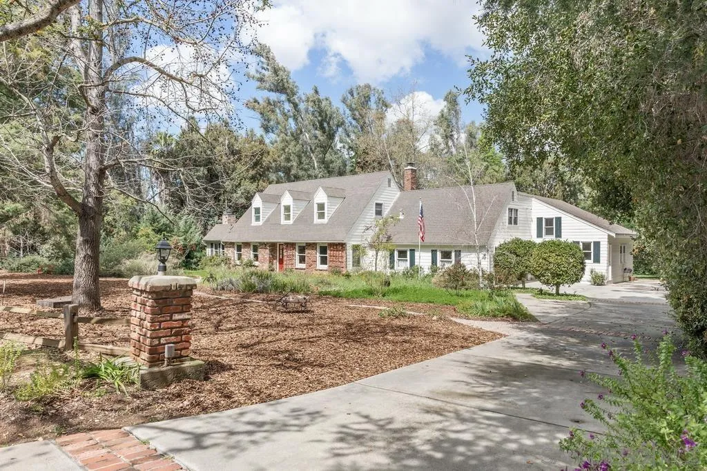 13636 Jack Rabbit Road Poway, CA 92064 - Photo 5 of 29 a view of a big house with a big yard and large tree