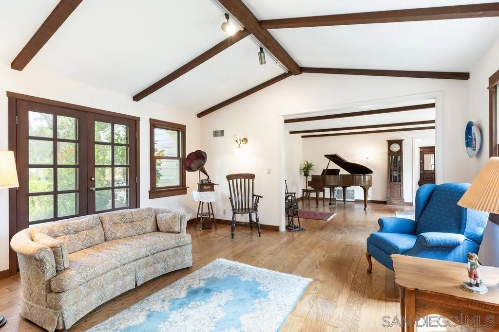 13636 Jack Rabbit Road Poway, CA 92064 - Photo 8 of 29 a living room with furniture and a large window