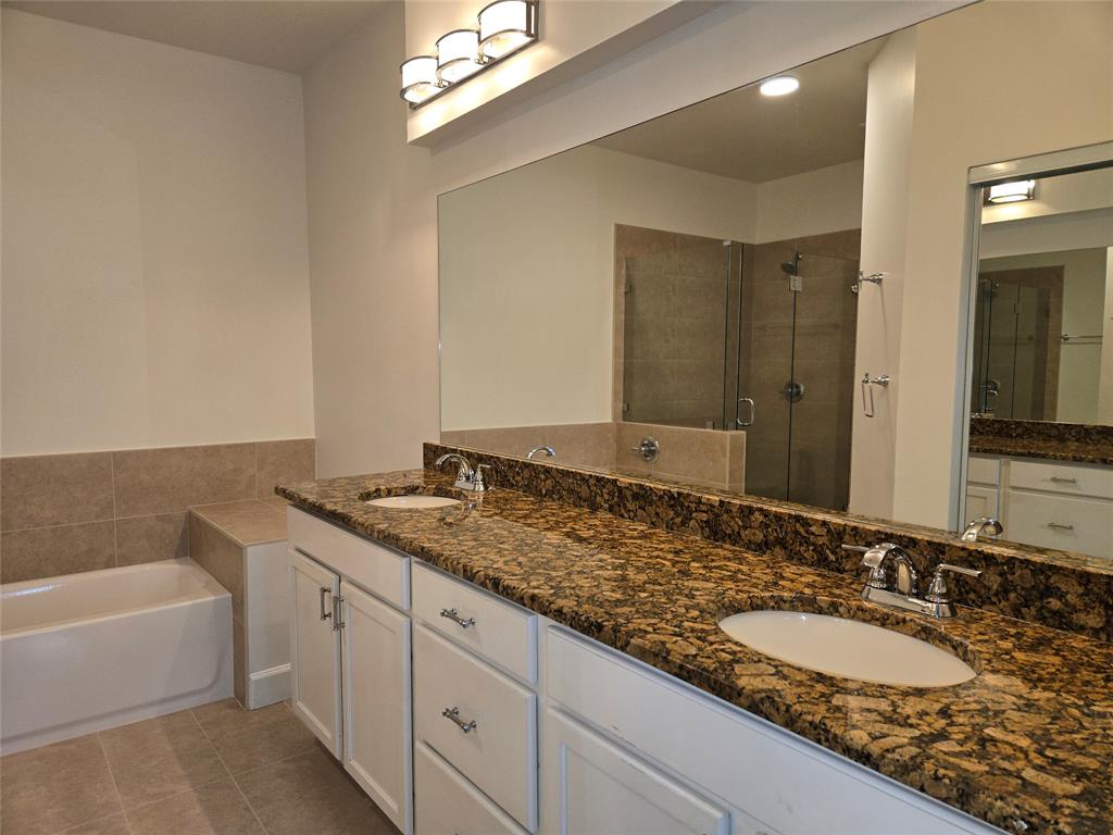 5800 Coach House Circle, Unit D Boca Raton, FL 33486 - Photo 15 of 23 a bathroom with a granite countertop bathtub sink double and mirror