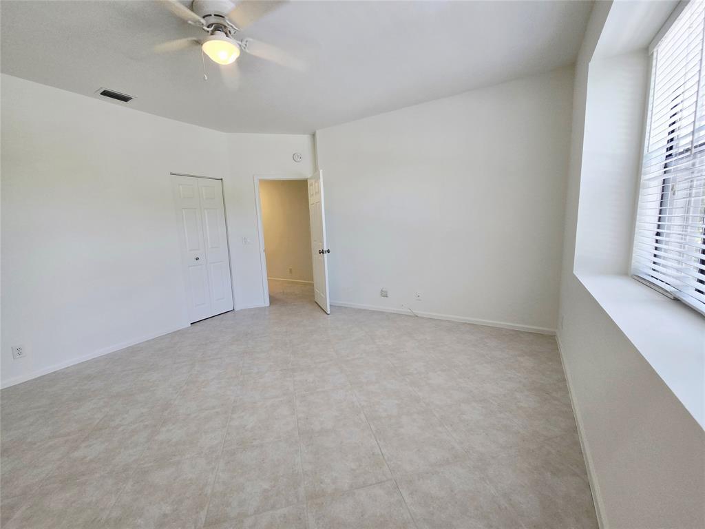5800 Coach House Circle, Unit D Boca Raton, FL 33486 - Photo 19 of 23 a view of an empty room with a window