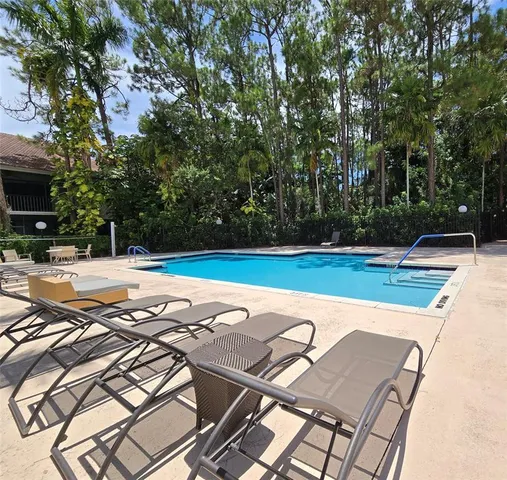 a view of a outdoor space with swimming pool
