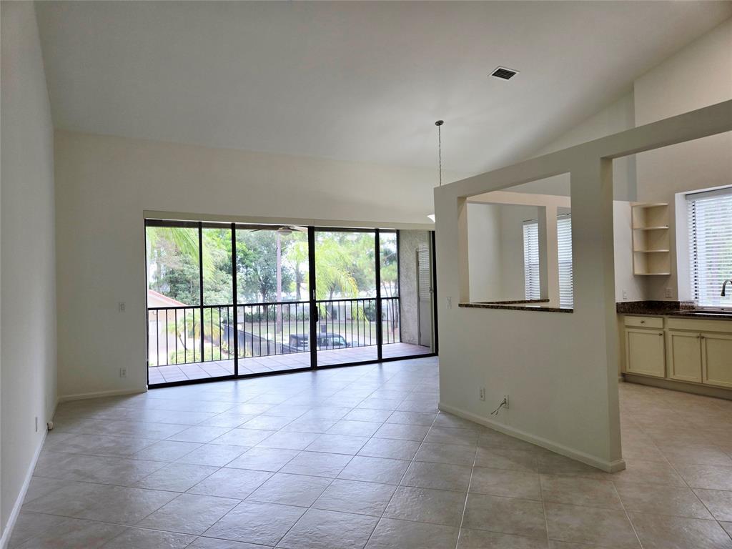 5800 Coach House Circle, Unit D Boca Raton, FL 33486 - Photo 8 of 23 a view of an empty room with a window