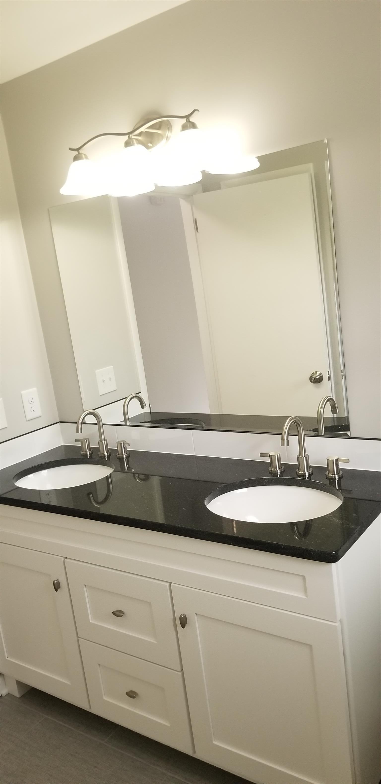 207 South Valley Road Hendersonville, TN 37075 - Photo 13 of 21 a bathroom with a double vanity sink and a mirror